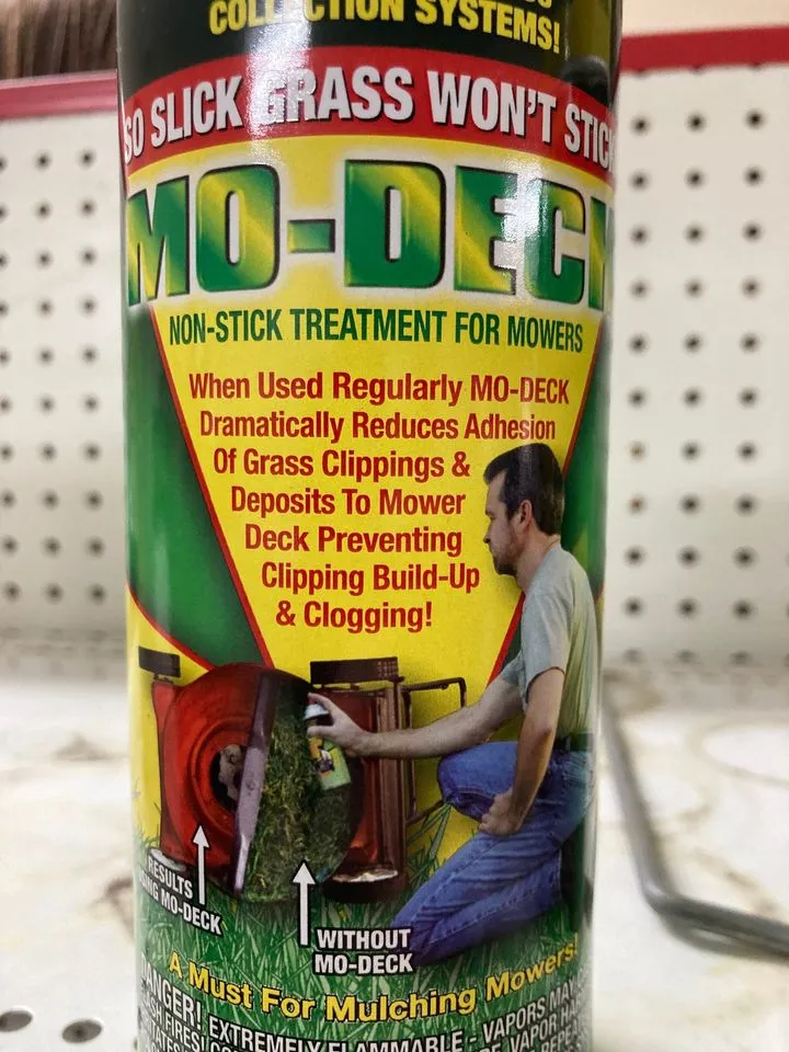 Non-stick spray for mower deck